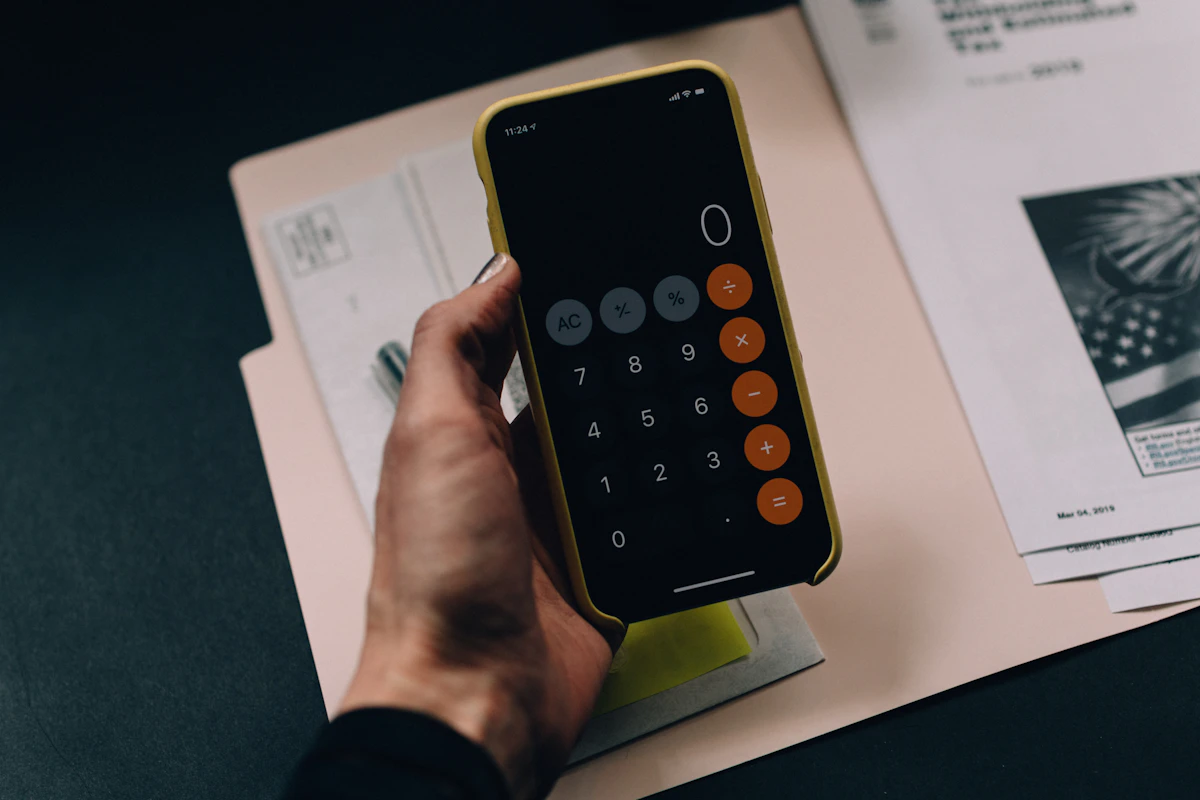 Person using a calculator for their 2026 Canadian tax return, exploring the best online tax accounting services in Canada