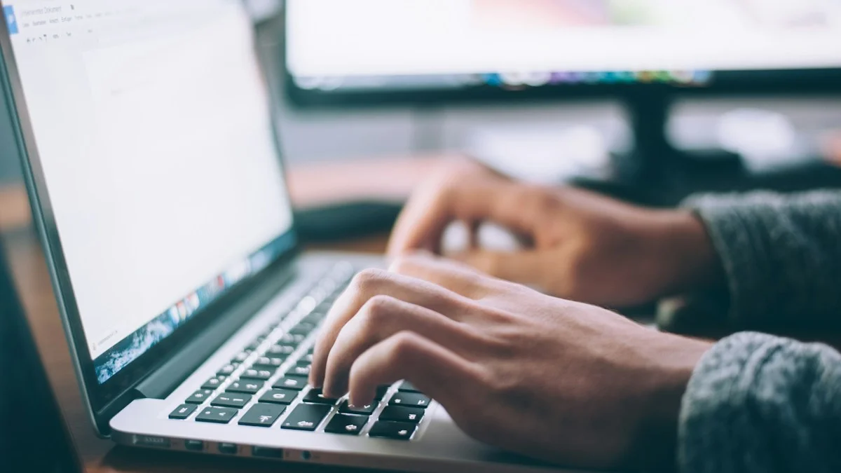 Freelance professional managing bookkeeping side hustle clients on modern laptop - Snipay