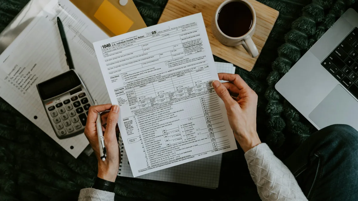 Desk illustration with tax forms and receipts for self-employed income